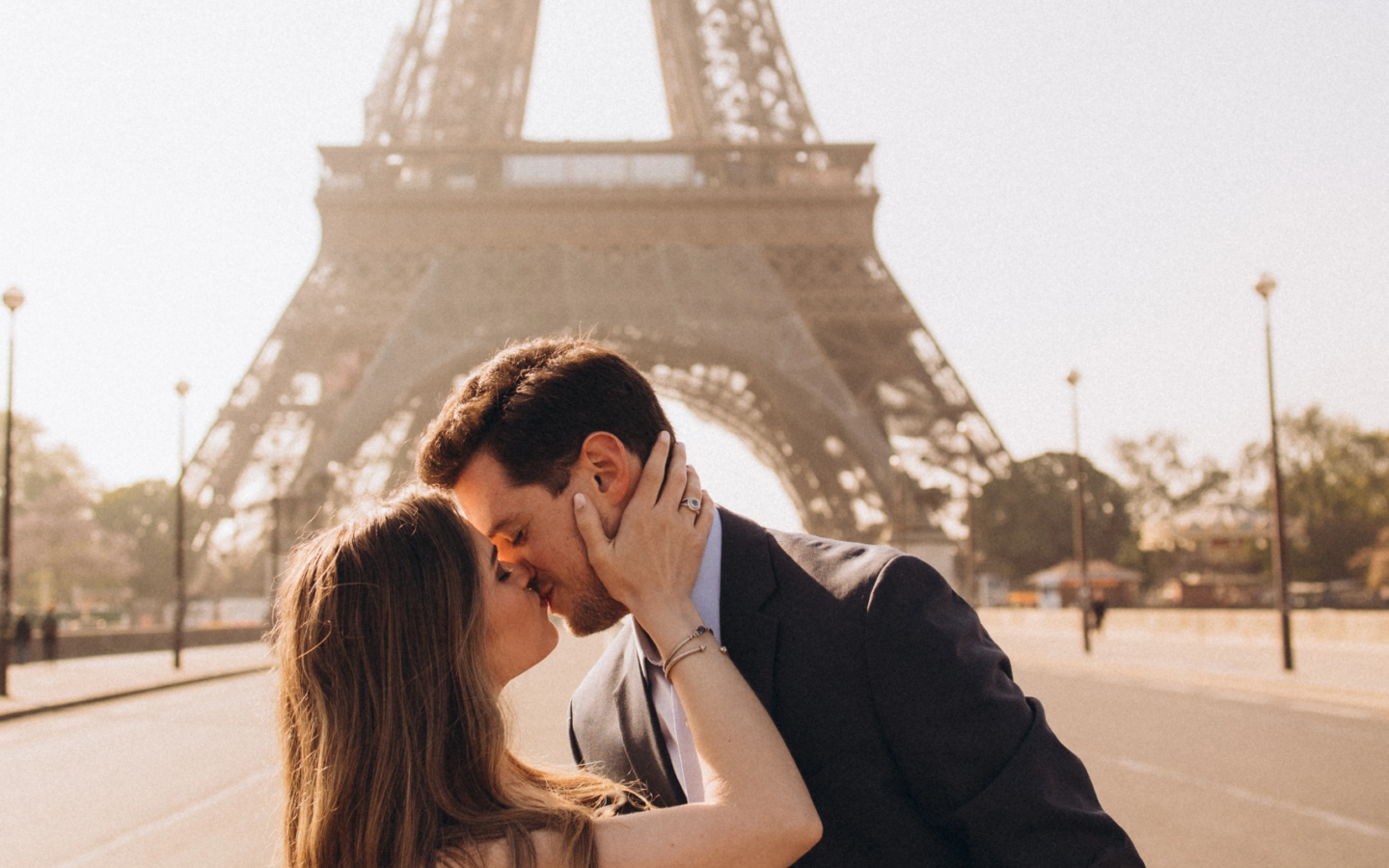 Couple kissing at Trocadero with the Eiffel Tower behind, Paris
