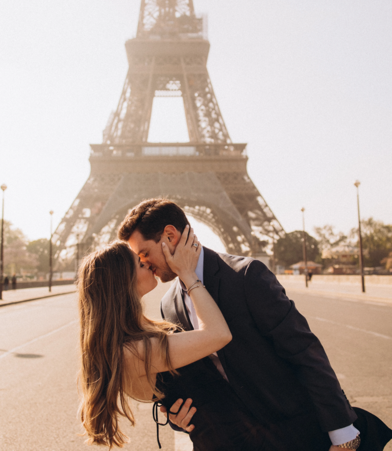 Couple kissing at Trocadero with the Eiffel Tower behind, Paris
