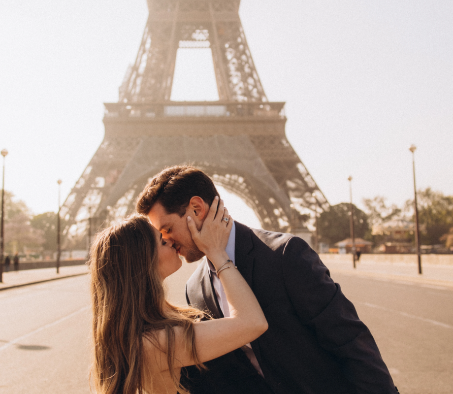 Couple kissing at Trocadero with the Eiffel Tower behind, Paris