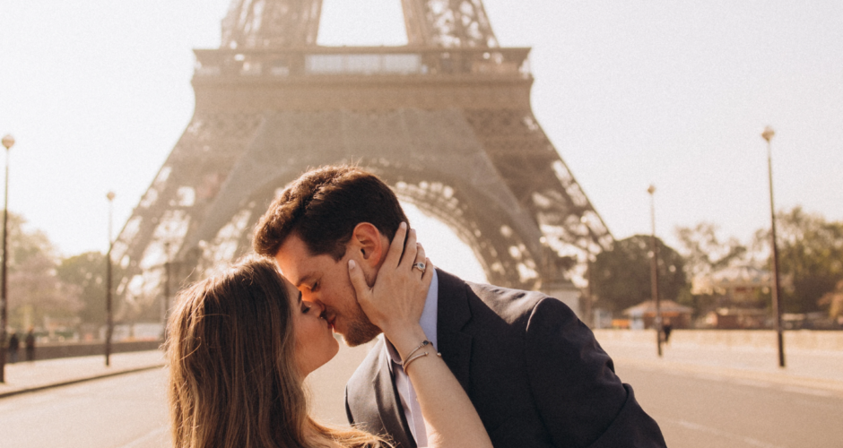 Couple kissing at Trocadero with the Eiffel Tower behind, Paris