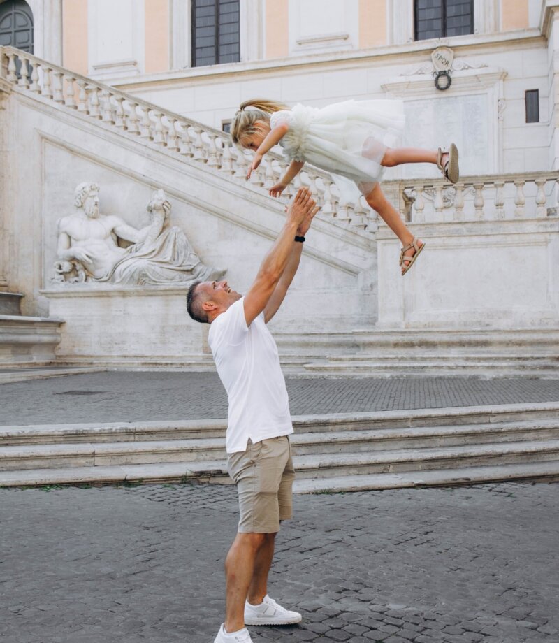Dad lifting his daughter on the Capitoline Hill, Rome